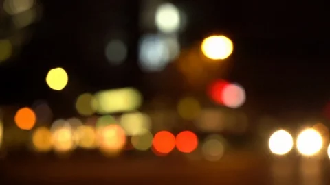 Defocused pan shot of a busy intersection in Berlin at night Stock Footage 120929811