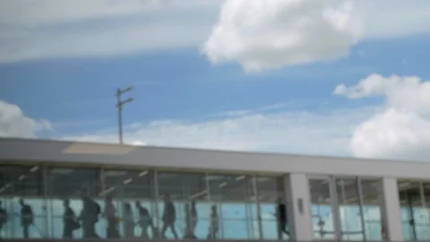 Defocused Passengers walking inside Boarding Bridge at Airport. Departure Tunnel Stock Footage 119858890
