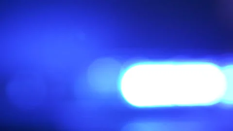 Defocused police red blue emergency lights flashing in the dark Stock Footage 94987127