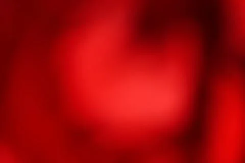 Defocused red background. Abstract background. Blurred red rose close-up. Stock Photos