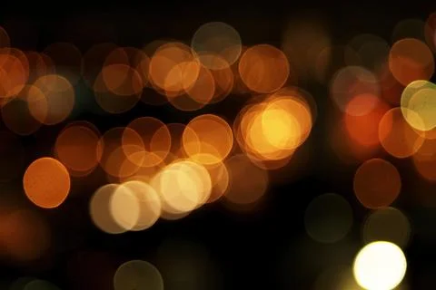 Defocused round lights with black background. Blur concept. Stock Photos