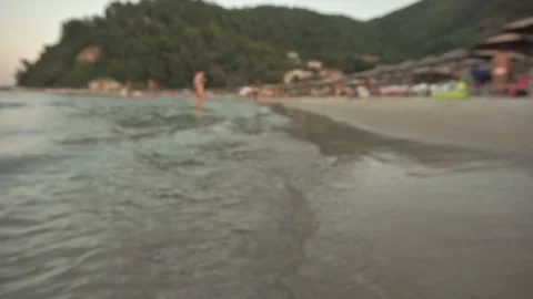 Defocused seaside summer theme with waves and people7 Stock Footage 115090163