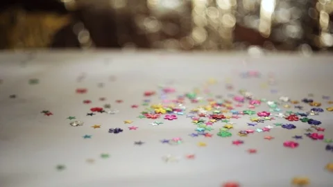 Defocused shimmering multicolored sequins falling down. Stock Footage 98313624
