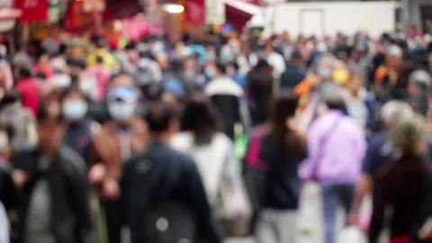 Defocused shot of crowd of people walking down market street in Tuen Mun Vídeo Stock 341110468