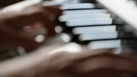 Defocused shot of hands playing keyboard Stock Footage 113284914