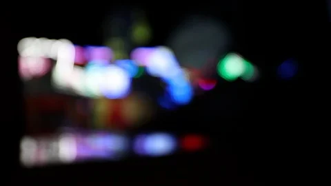 Defocused shot of moving carousel ride at night Stock Footage 123705788