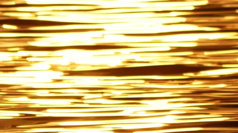 Defocused shot of small ripple wave in sea, shiny sparkling sunlight reflecti Stock Footage 130578895