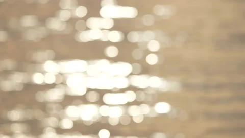 Defocused shot of small ripple wave in sea, shiny sparkling sunlight reflecti Stock Footage 130583677