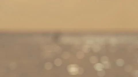 Defocused shot of small ripple wave in sea, shiny sparkling sunlight reflecti Stock Footage 130584857