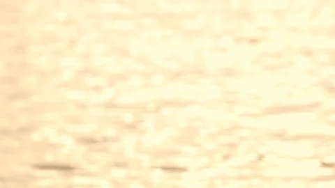 Defocused shot of small ripple wave in sea, shiny sparkling sunlight reflecti Stock Footage 130585390