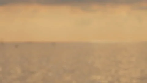 Defocused shot of small ripple wave in sea, shiny sparkling sunlight reflecti Stock Footage 130585622