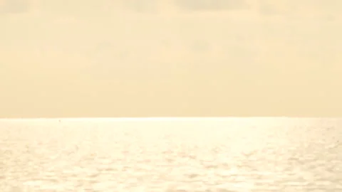 Defocused shot of small ripple wave in sea, shiny sparkling sunlight reflecti Stock Footage 130585752