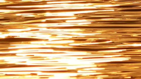 Defocused shot of small ripple wave in sea, shiny sparkling sunlight reflecti Stock Footage 130588434