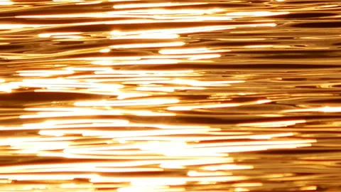 Defocused shot of small ripple wave in sea, shiny sparkling sunlight reflecti Stock Footage 130588472