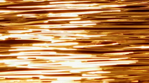 Defocused shot of small ripple wave in sea, shiny sparkling sunlight reflecti Stock Footage 130588593