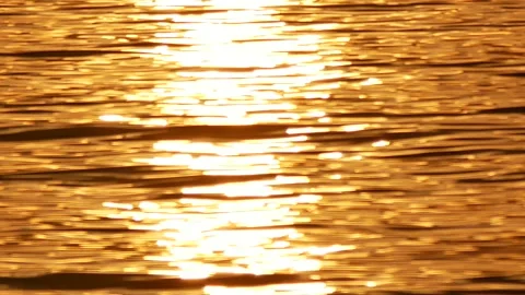 Defocused shot of small ripple wave in sea, shiny sparkling sunlight reflecti Stock Footage 130588767