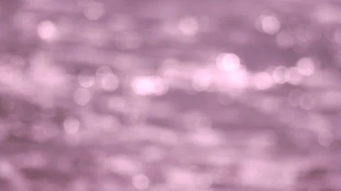 Defocused shot of a wavy water surface with a beautiful bokeh. Stock Footage 93792606