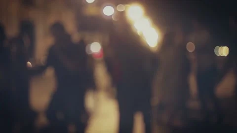 Defocused silhouettes of dancing couples in the night street in slow motion. Stock Footage 143506135