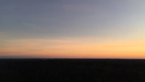 Defocused sky time lapse with fires blinking on the horizon Видео 136815675