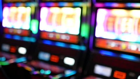 Defocused slot machines glow in casino on fabulous Las Vegas Strip, USA. Blurred Stock Footage