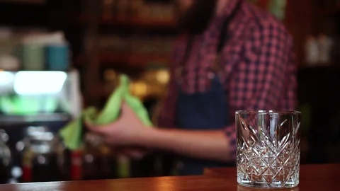 Defocused sow motion view on concentrated male barista busy working by Stock Footage 103804164