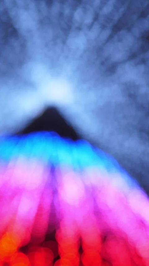 Defocused string lights change color christmas tree on rainbow iridescent colors Stock Footage 253549357