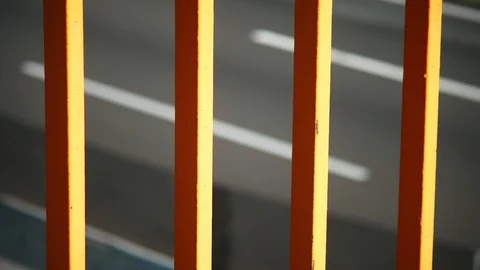 Defocused Traffic on Highway behind Grids 4K Stock Footage 90793054