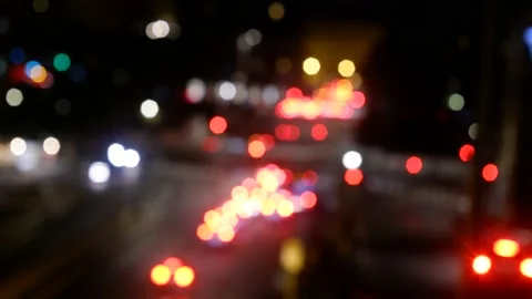 Defocused traffic lights at night Stock Footage 167662688