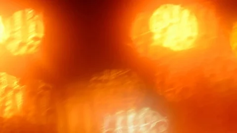 Defocused traffic lights through wet car glass. Stock Footage 73619918