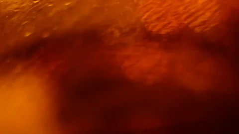 Defocused traffic lights through wet car glass. Stock Footage 73619950