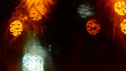 Defocused traffic lights through wet car glass. Stock Footage 73620050