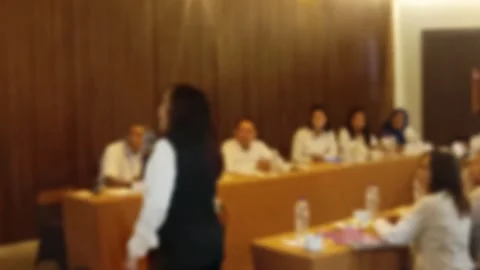 Defocused video of A diverse group people attending a business meeting or Stock Footage 340533734