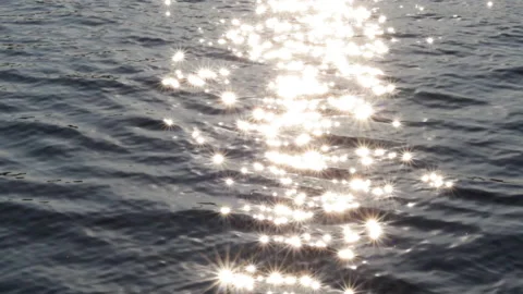Defocused video of sun reflection in lake sea water. Stock Footage 183396800