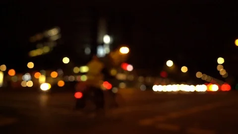 Defocused view of busy intersection at night with city traffic Stock Footage 122368076