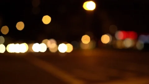 Defocused view of busy intersection at night Stock Footage 123901172