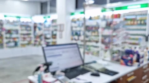 Defocused view inside of pharmacy with the seller counter, computer and cash reg Video stock 261960447