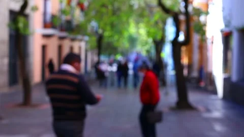 Defocused view of a street full of unrecognisable people with facemasks Stock Footage 155298727