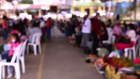 A defocused view of an unrecognisable crowd of people with face masks Stock Footage 153720542