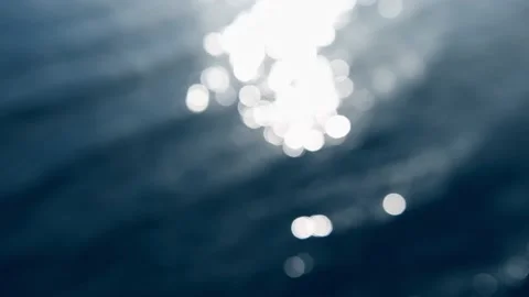 Defocused water surface with sun reflections. Stock Footage 220461606