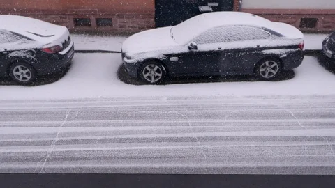 Defocused Winter Slow Motion Concept of Snowy Street and Snow Falling  Stock Footage 117354592