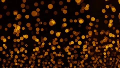 Defocused yellow bokeh on a dark background Video stock 236599439