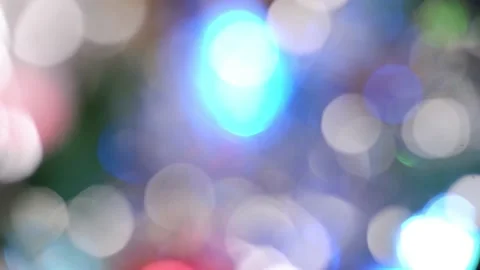 Defocusing a decorated Christmas tree. Bokeh glare is multicolored. Shiny spots Stock Footage 167366146