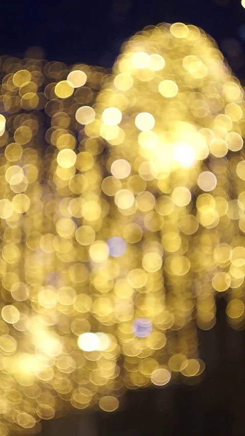 Defocusing vertical garlands in winter evening streets Stock Footage 124703893