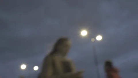 Defocussed view of commuters at rush hour at dusk on london bridge Stock Footage 96360335