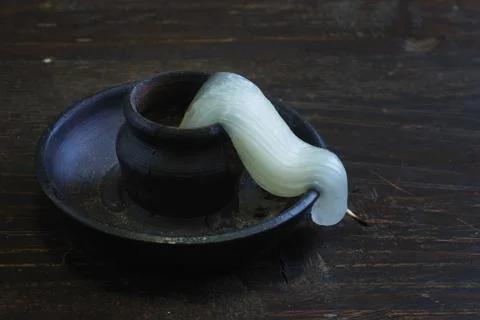 Deformed candle-end Stock Photos