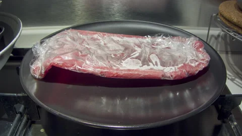 Defrost the steak Stock Footage 157938656