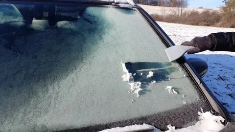 Defrost of windscreen by ice scraper in very freezing weather.  Stock Footage 262172851