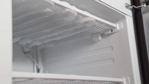 Defrosting the refrigerator from ice . Stock Footage 245304816