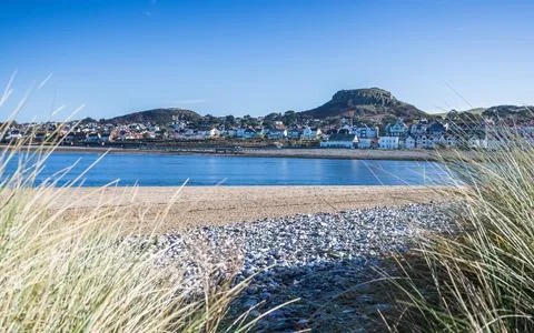 Deganwy seafront framed by dune grass Stock Photos