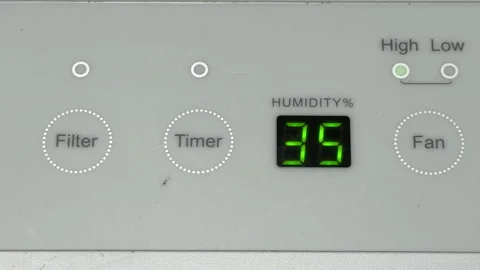 Dehumidifier Panel Emits a Final Sharp Beep and Fading Mechanical Hum Stock Footage 328917619